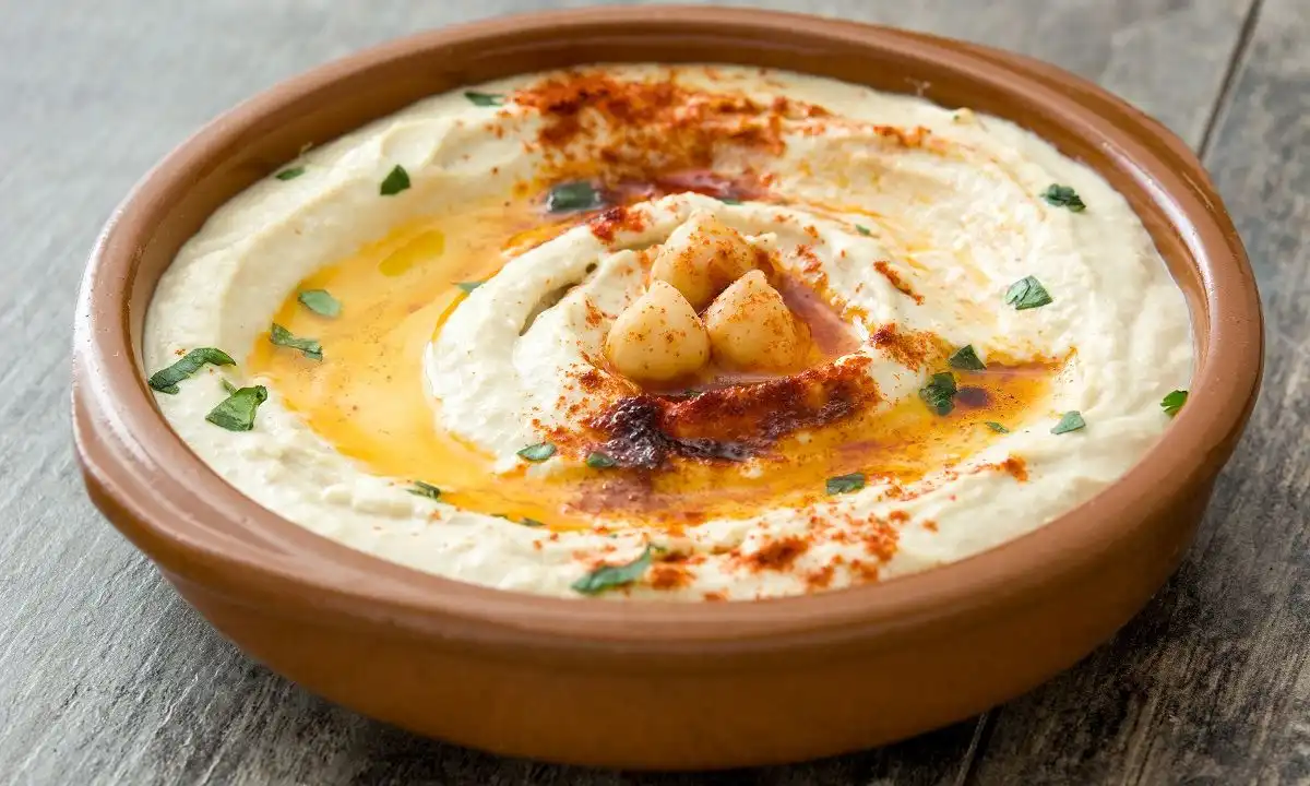 The Secret to Creamy Hummus! in a bowl